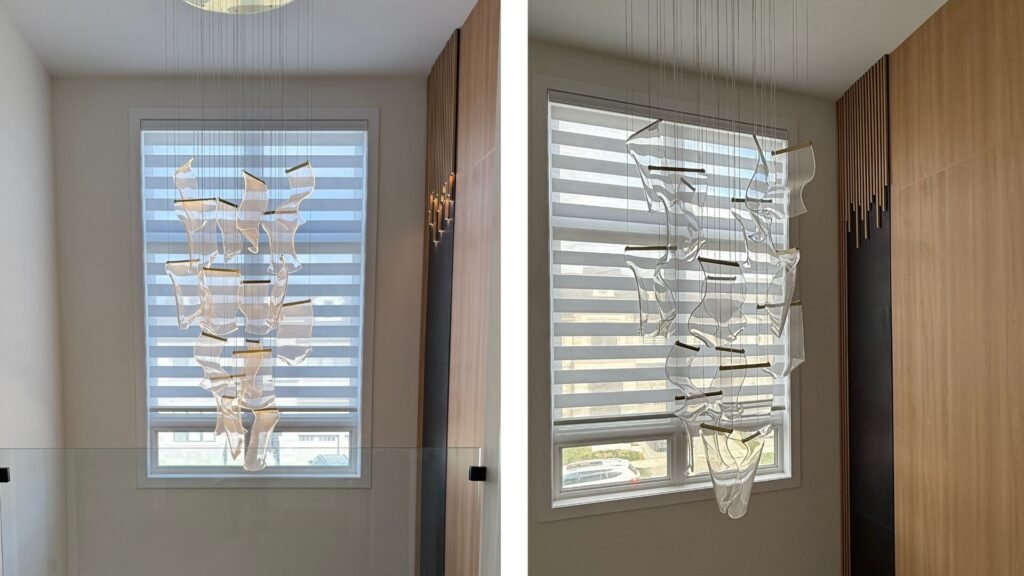 an oversized custom zebra blind that spans the full height of the staircase window