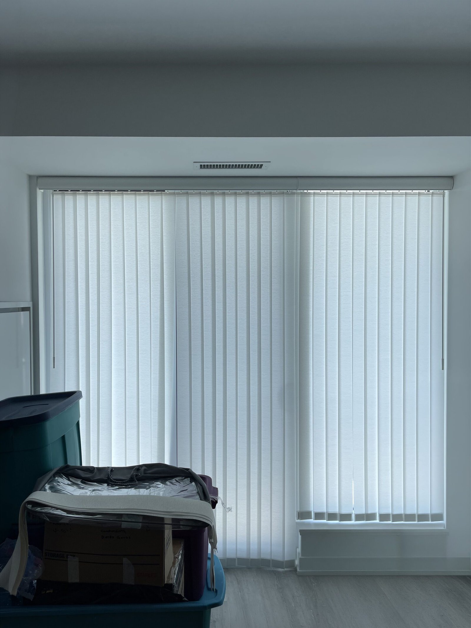 Vertical blinds providing light control in a Toronto living space
