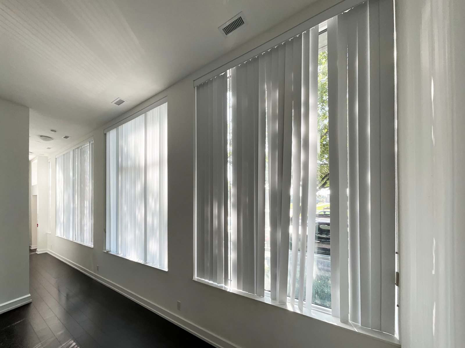 Custom vertical blinds covering a large window or sliding patio door in a Toronto home