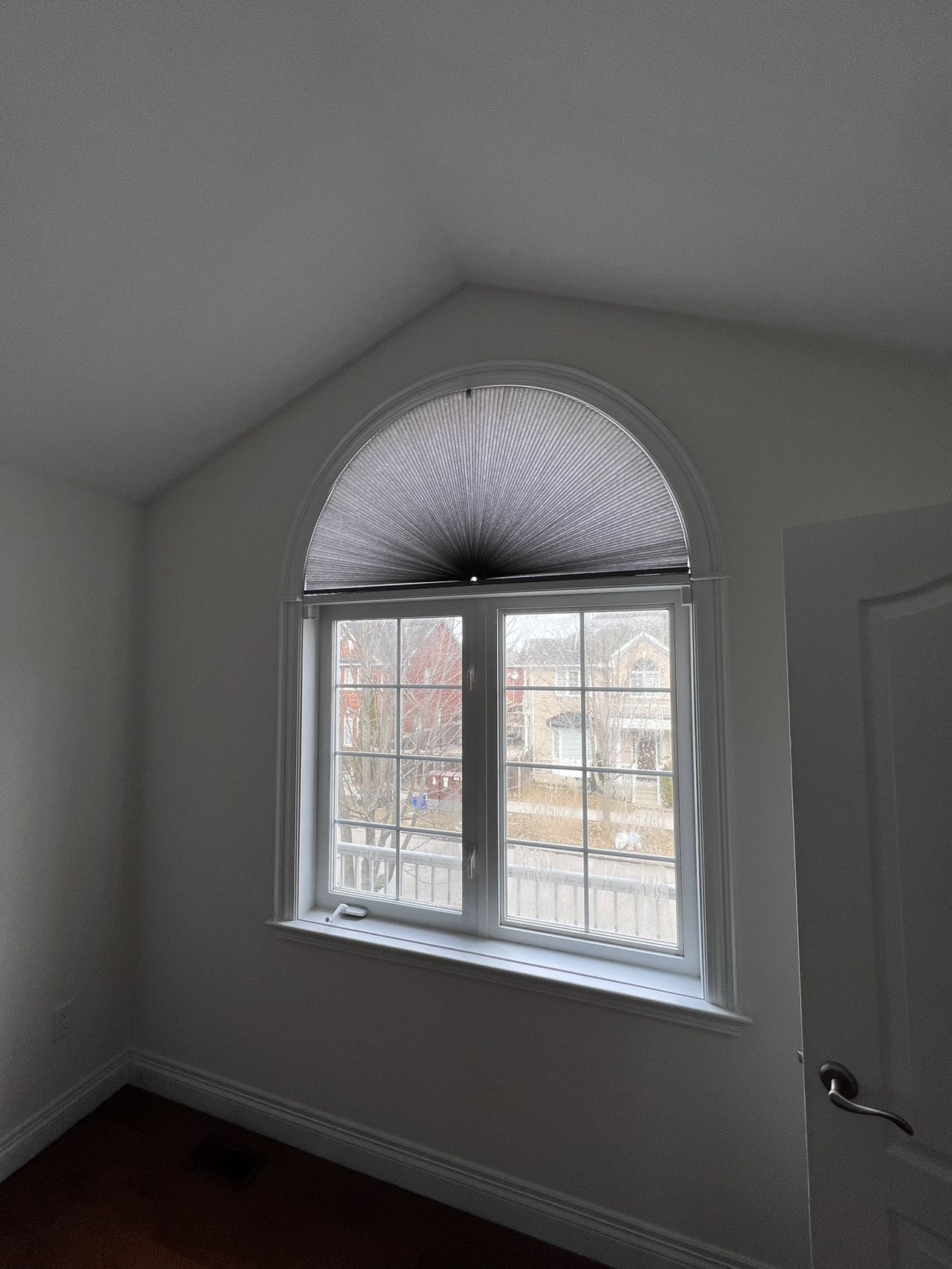 Custom plantation shutters fitted to a triple arched palladian window in Toronto — Starlight Shutter, shutters follow each arch precisely