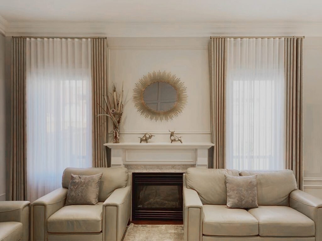 a living room with modern ripplefold blackout curtain and sheer in toronto