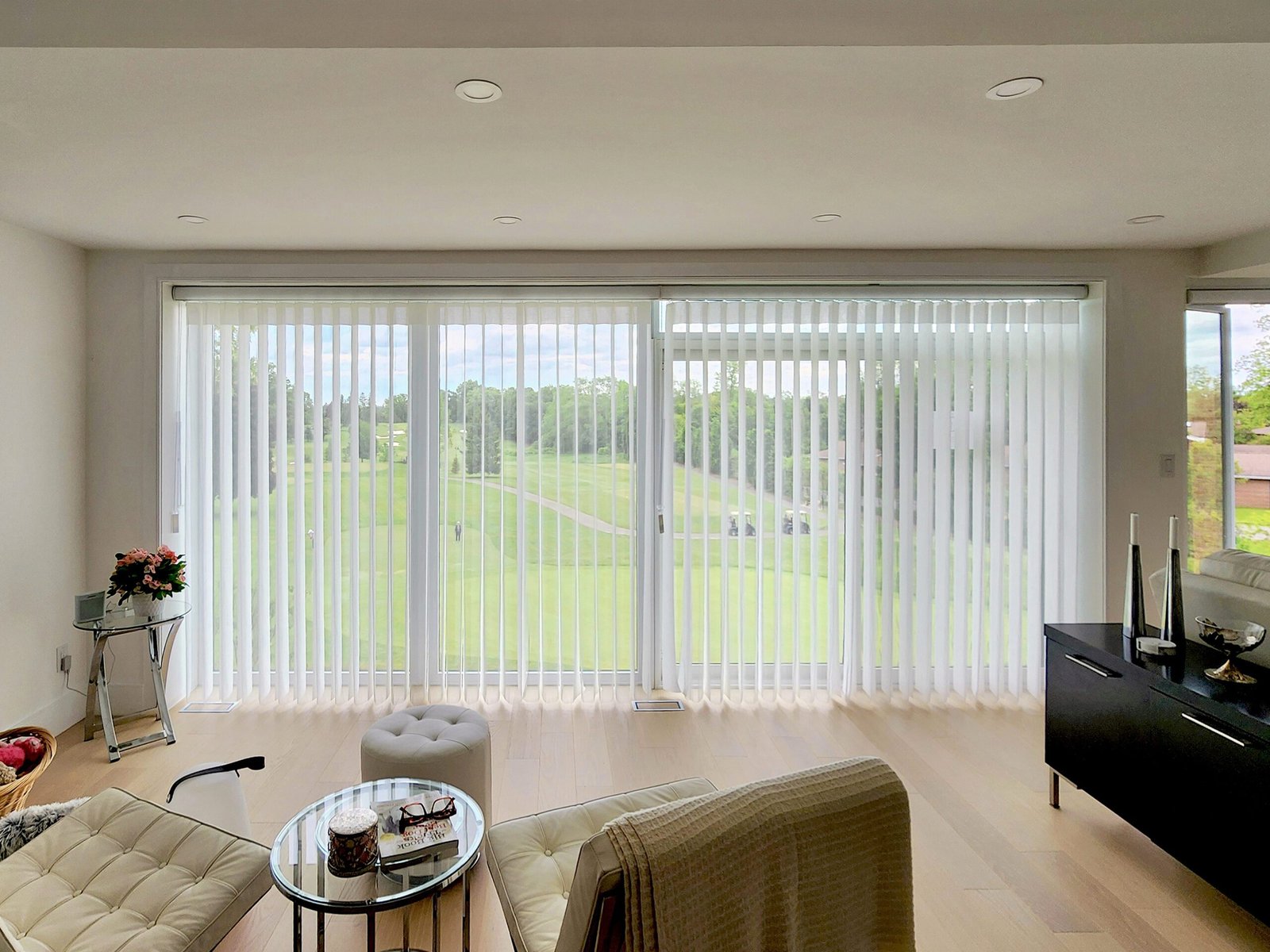 Custom Dream Shades vertical sheer covering large windows in a bright Toronto home
