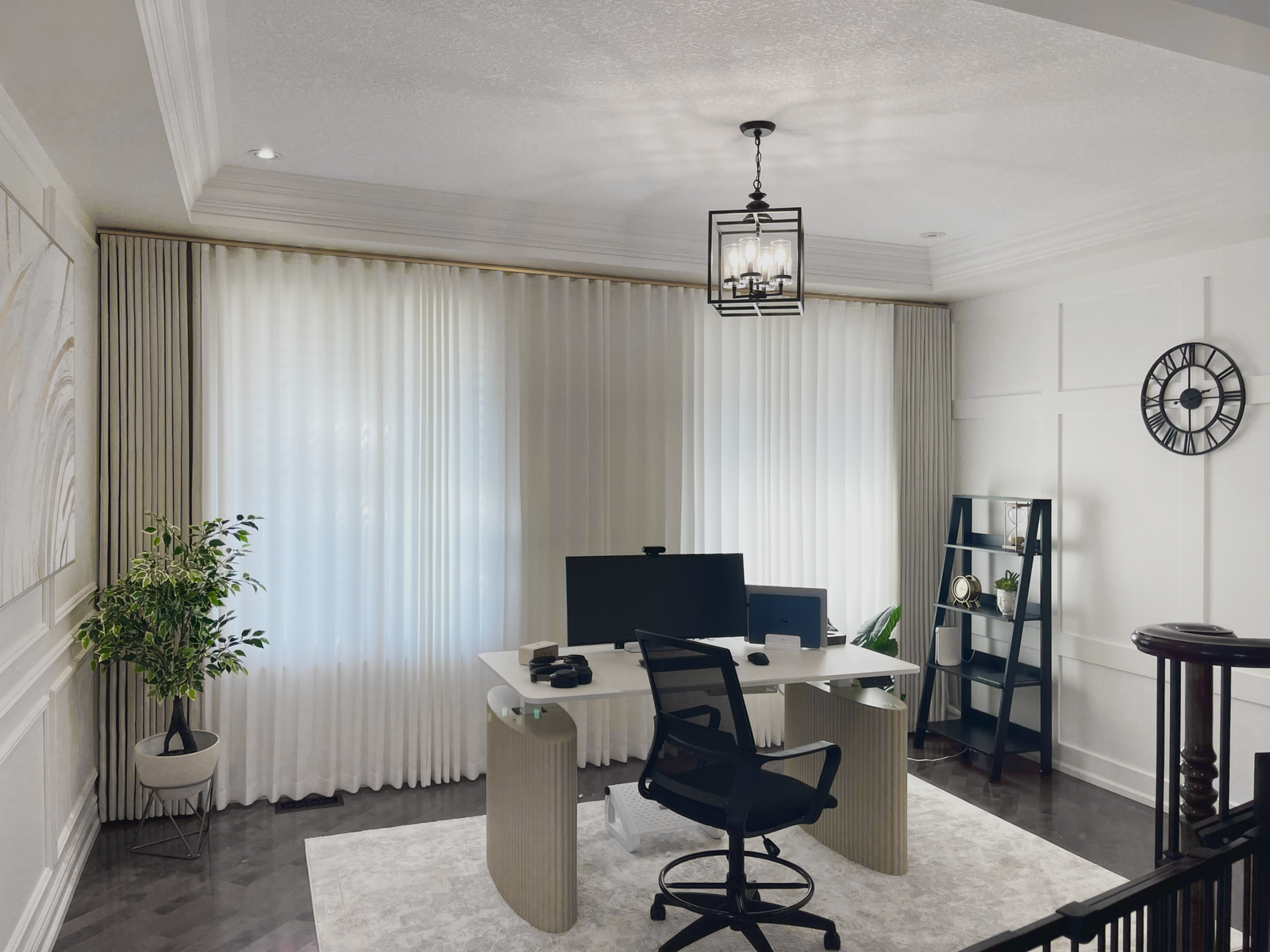 Blackout drapery layered over sheer curtains in a Toronto home office