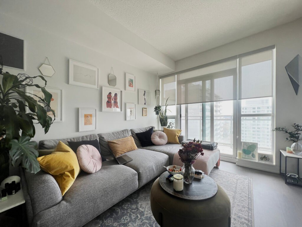 light through roller blinds in a cozy toronto condo living room instllaed by starlight shutter