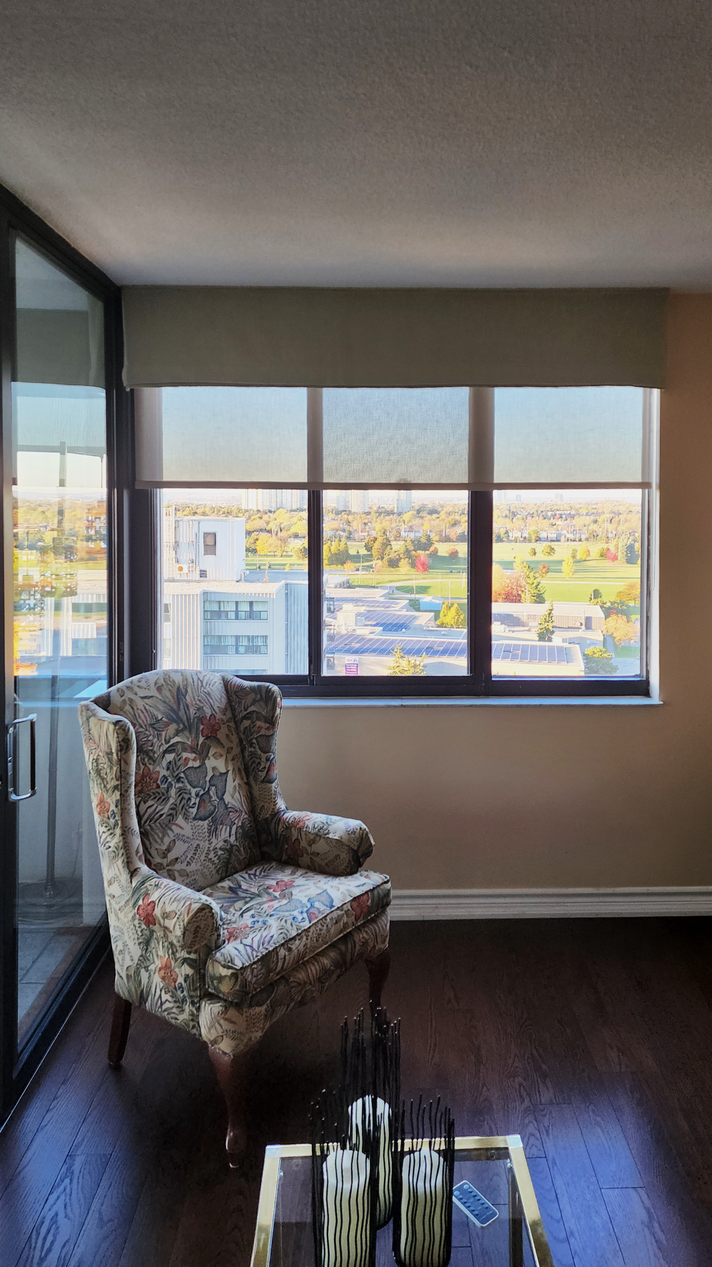 Solar shades with an open-weave fabric that keeps the view in a Toronto home