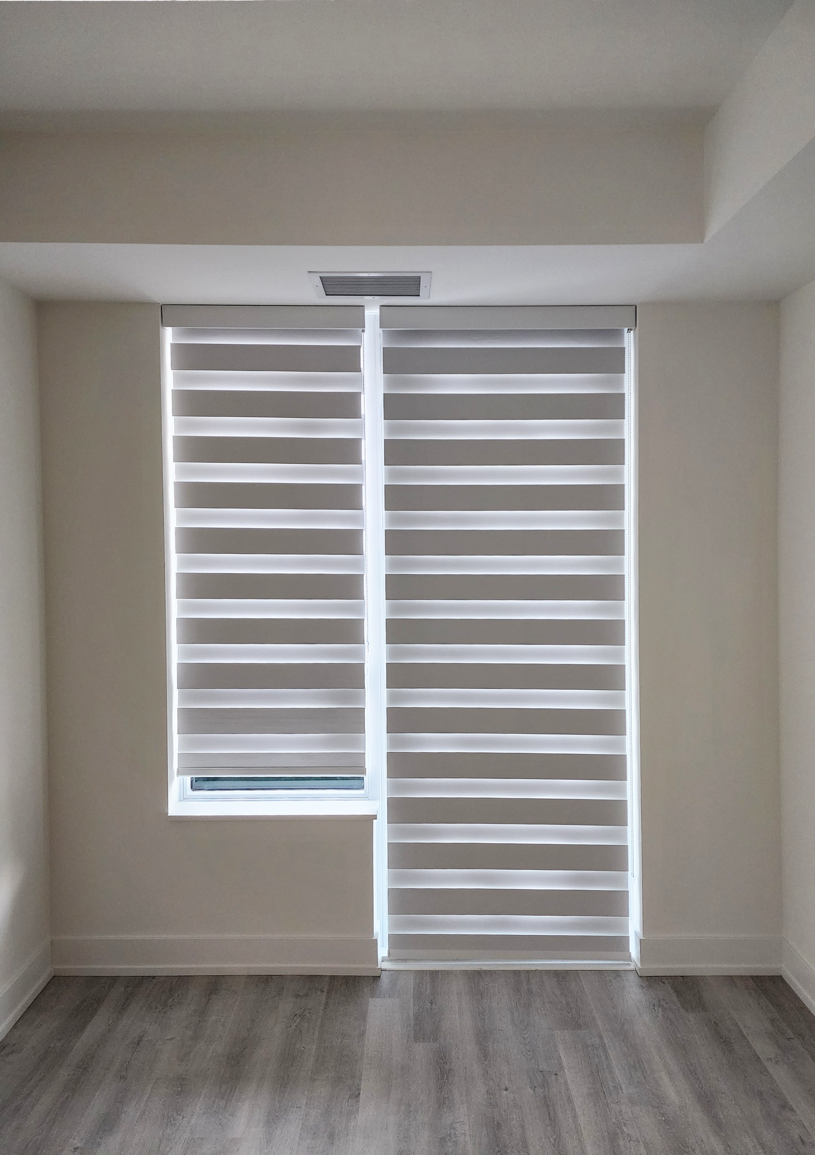 Zebra day-night blinds on a tall window in an Etobicoke home