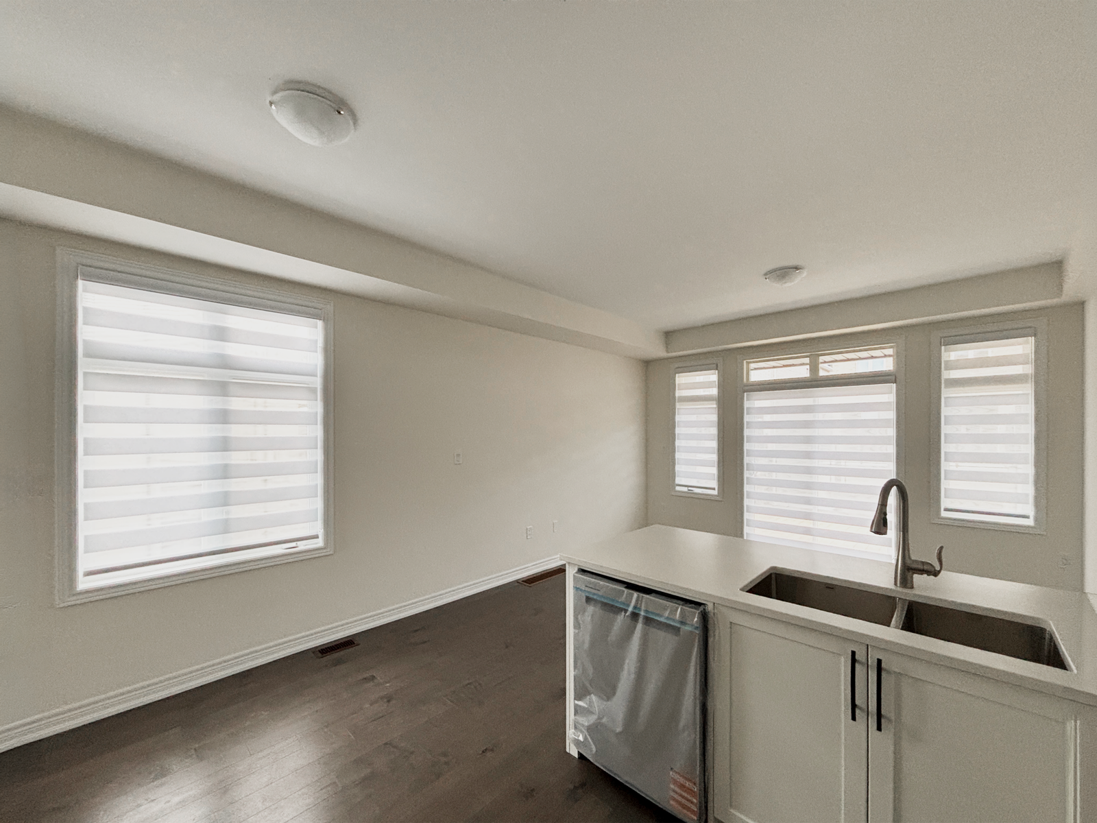 Zebra dual shades on kitchen windows in a Markham home