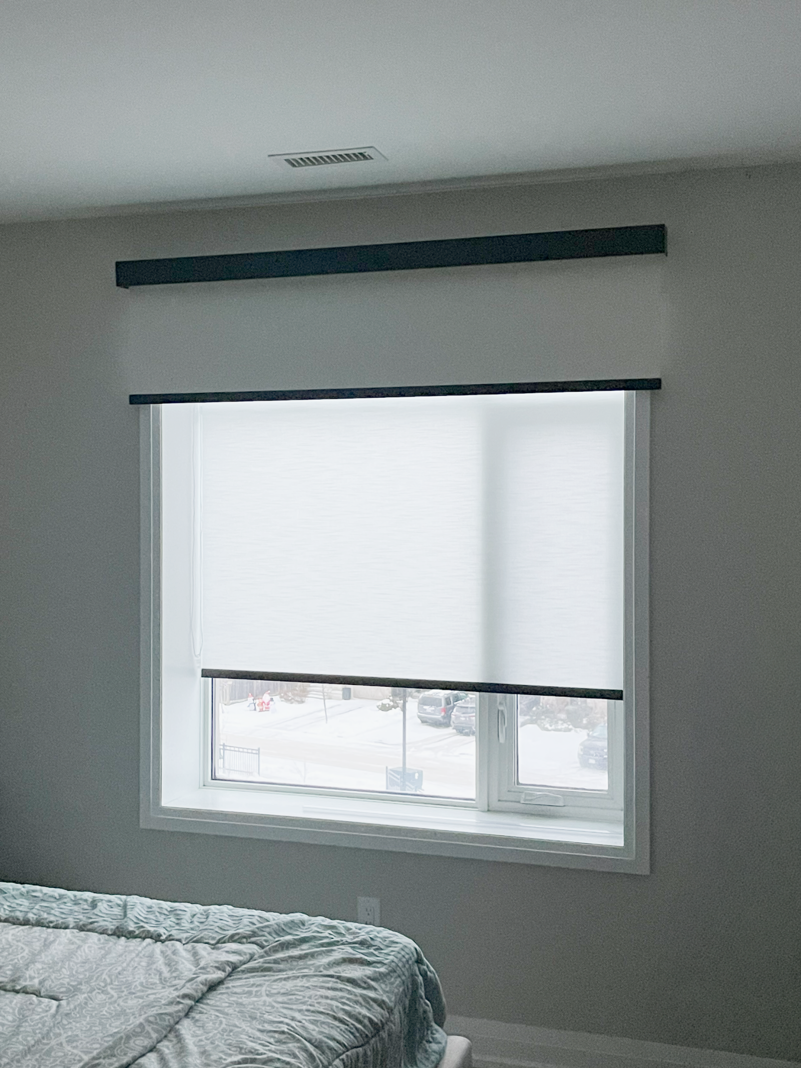 Custom window treatments installed in a sunlit Milton living room by Starlight Shutter