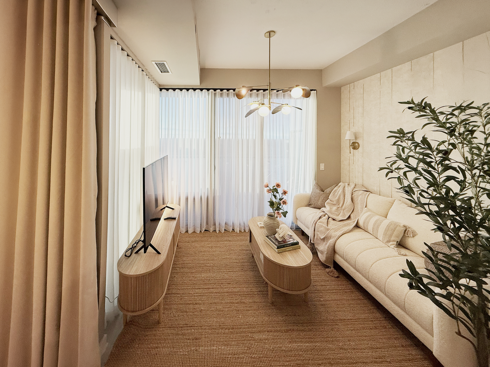 Custom window treatments installed in a sunlit North York home by Starlight Shutter