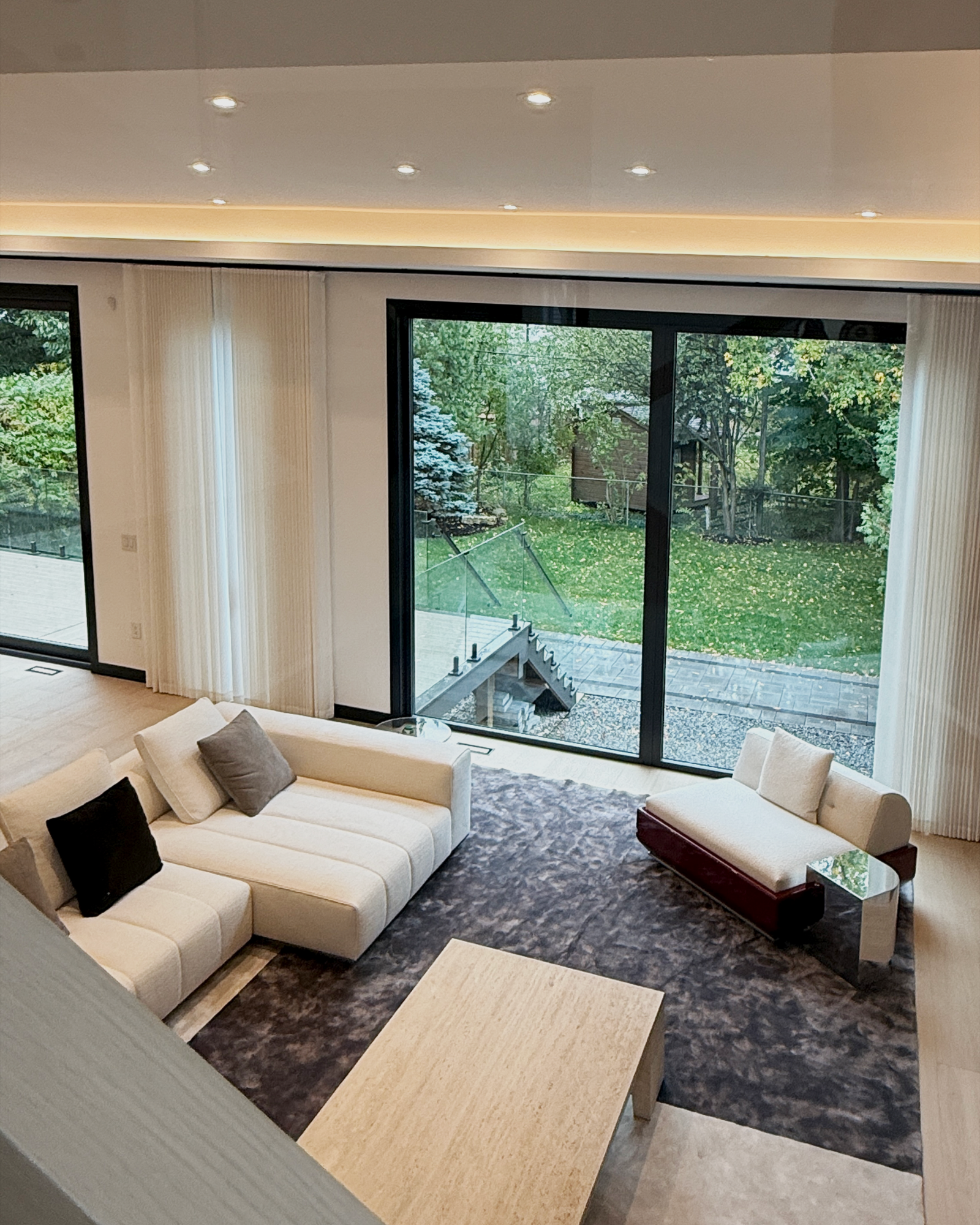 Motorized shades installed in a North York home by Starlight Shutter