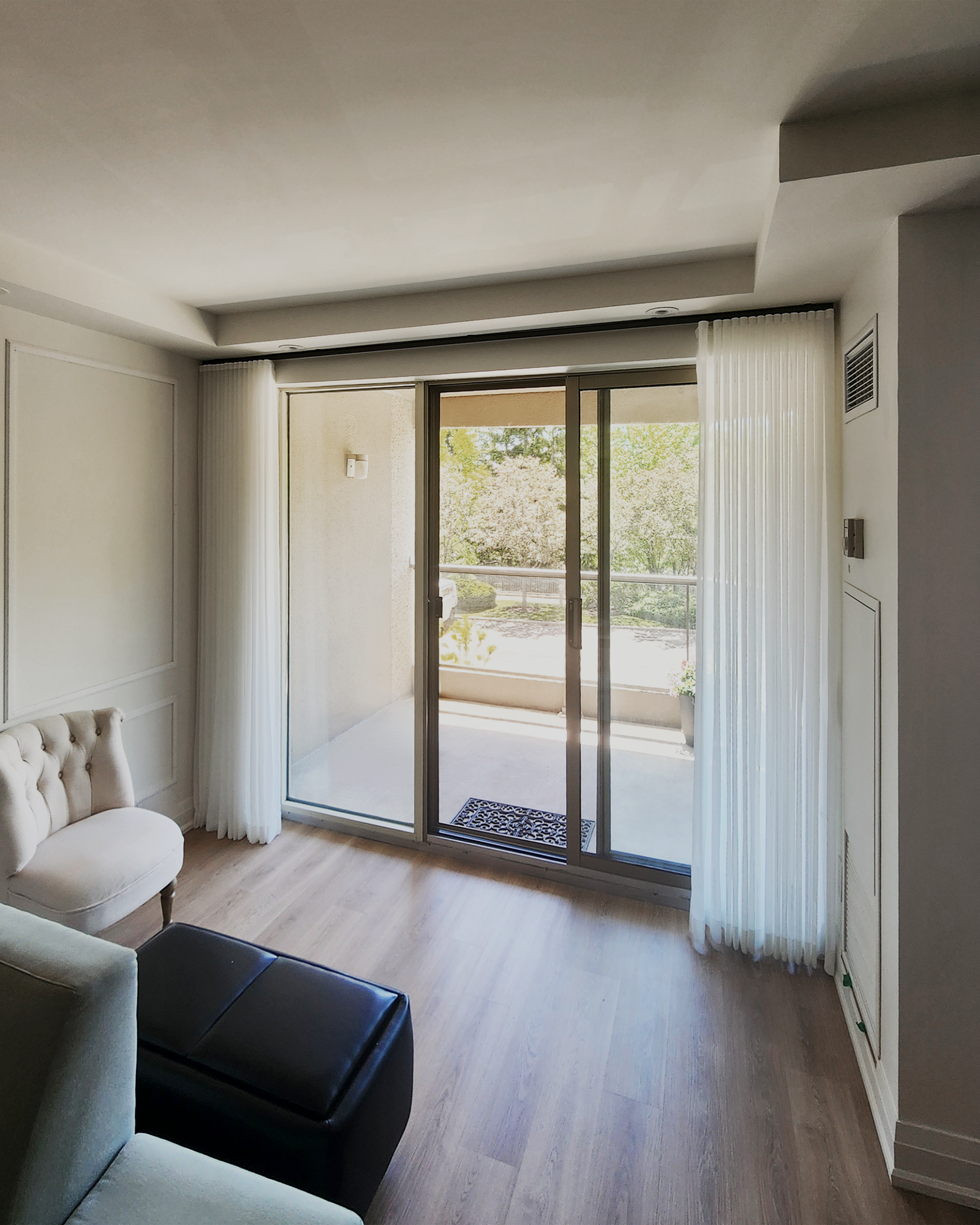 Custom window treatments installed in a sunlit Richmond Hill home by Starlight Shutter