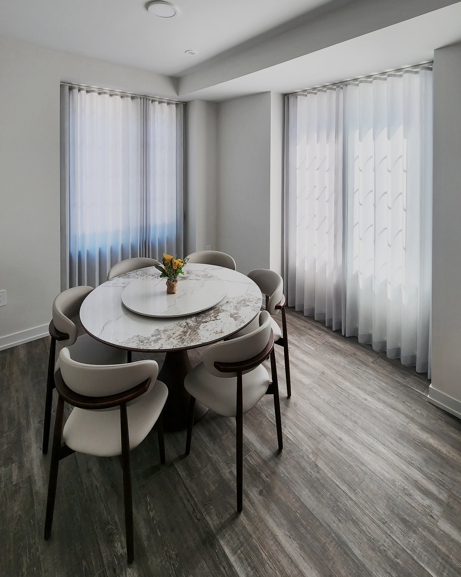 Sheer curtains in a Richmond Hill dining room by Starlight Shutter