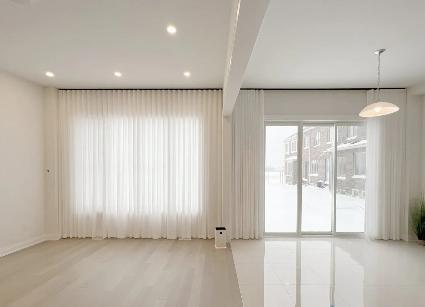 Sheer curtains filtering daylight in a Toronto living room