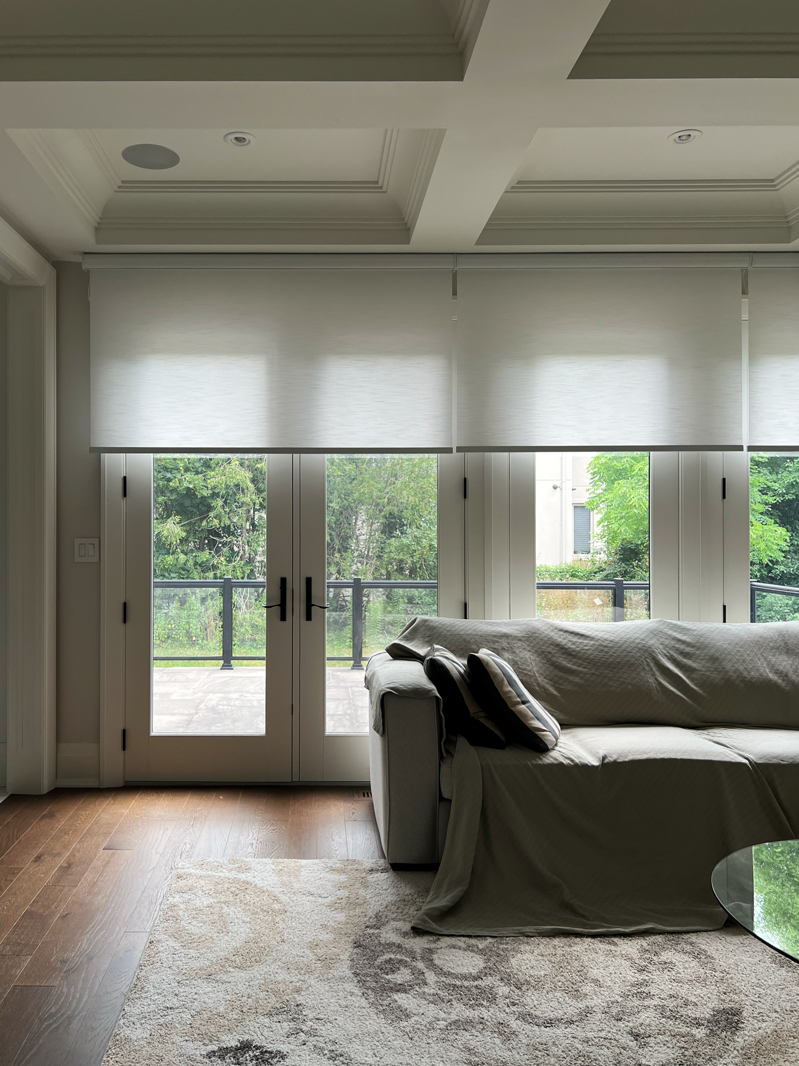 Motorized blinds installed in a great room of an Oakville home by Starlight Shutter