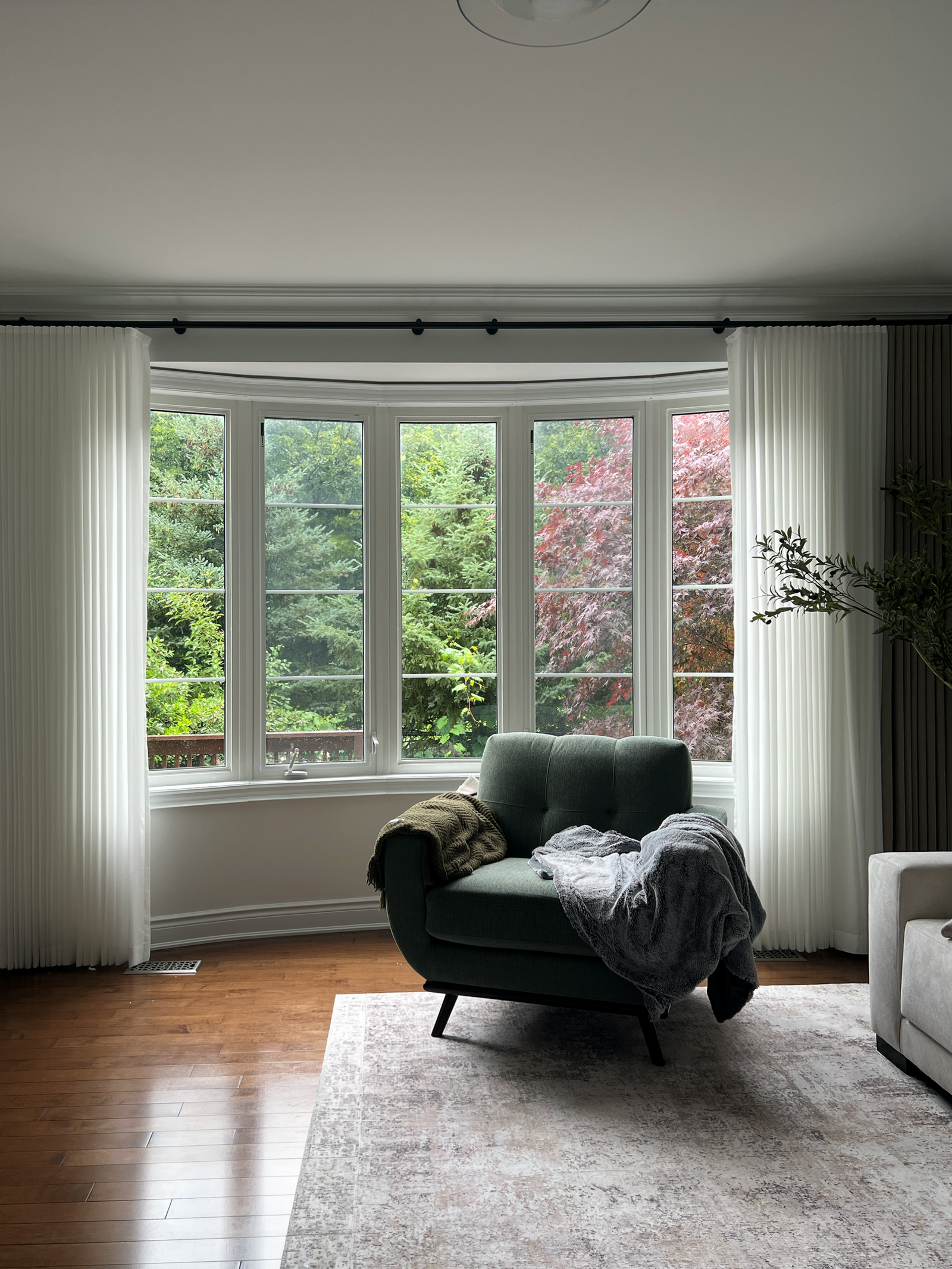 Custom window treatments installed in a sunlit Milton home by Starlight Shutter