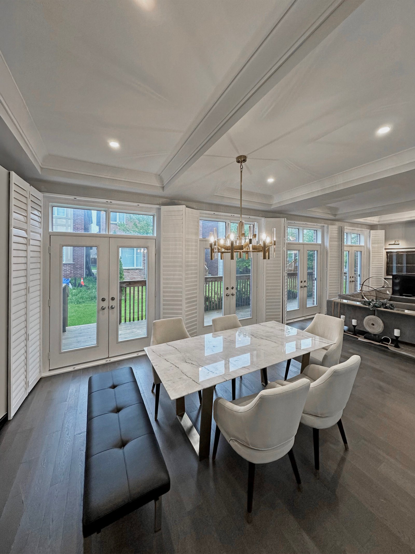 Bi-fold shutters fitted to a wide opening in a Toronto living space