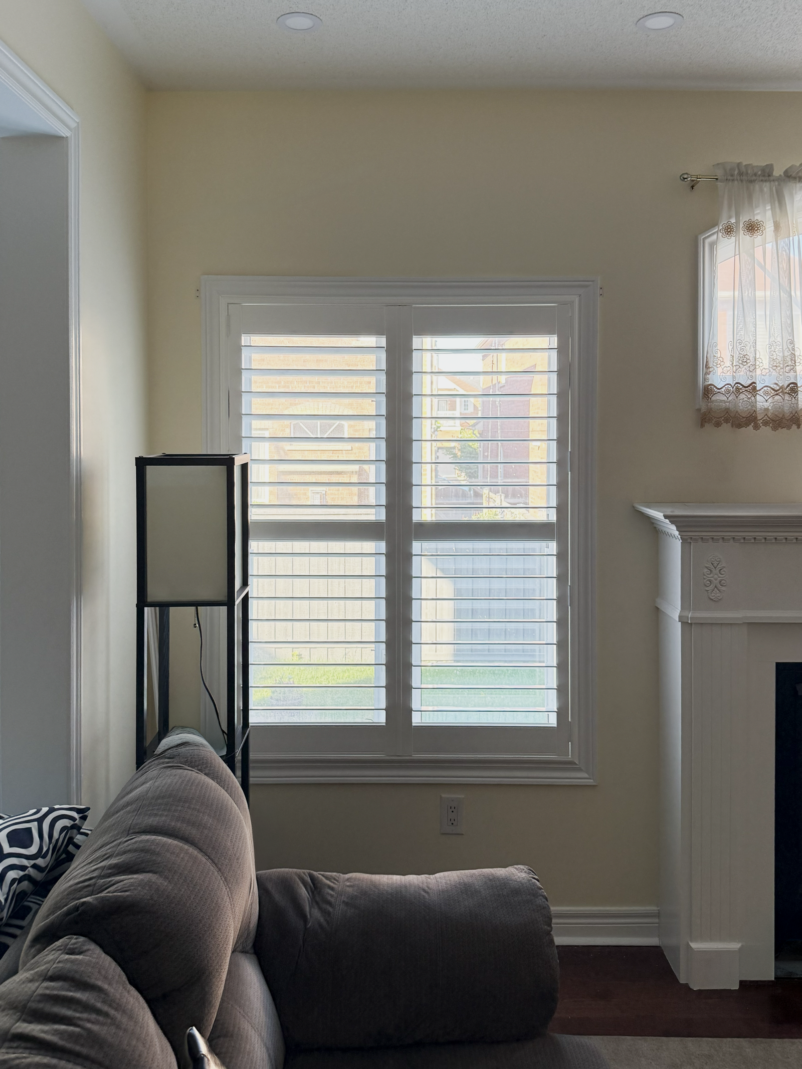 Custom window treatments installed in a sunlit Hamilton home by Starlight Shutter