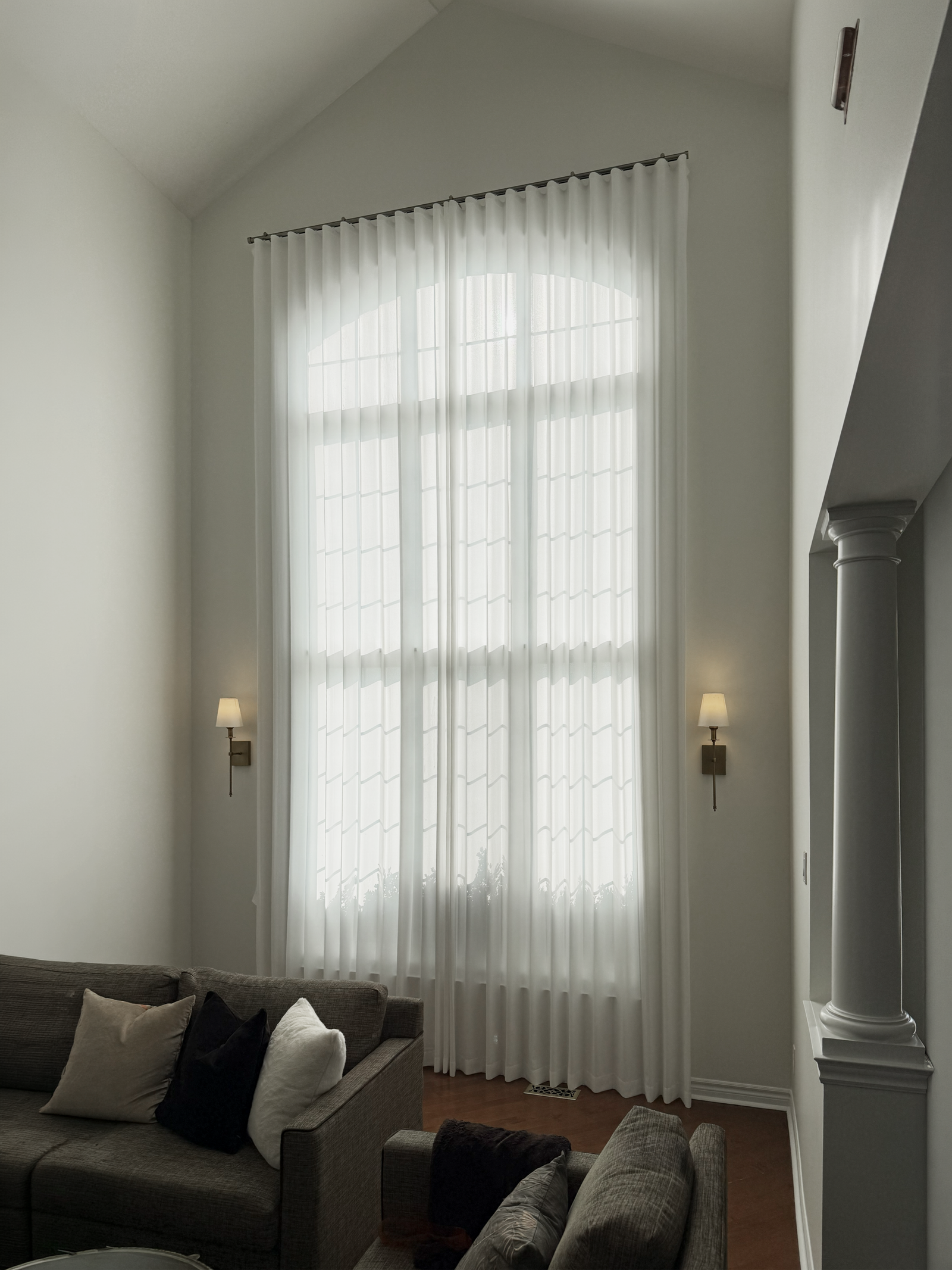 Custom window treatments installed in a sunlit Hamilton home by Starlight Shutter