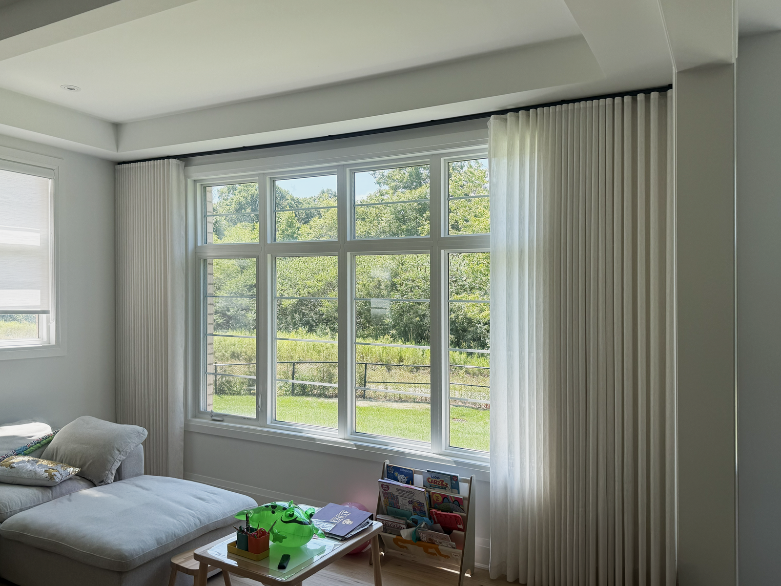 Sheer curtains framing a bright child's room