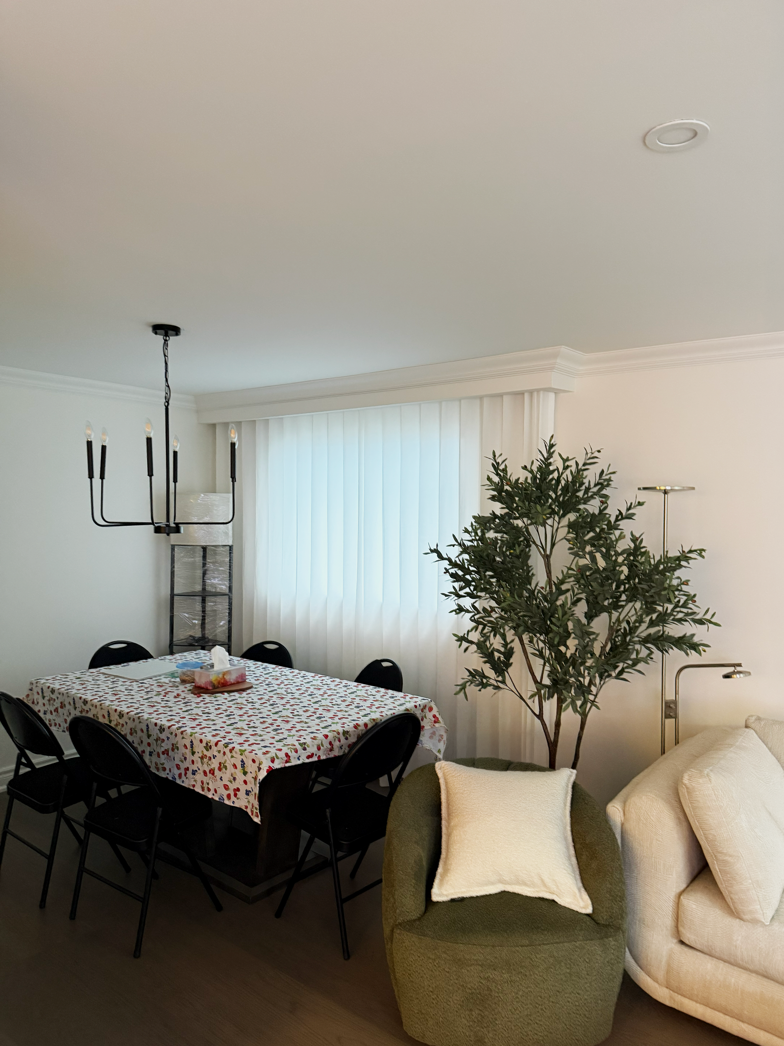 Custom sheer curtains softening the light in a dining area