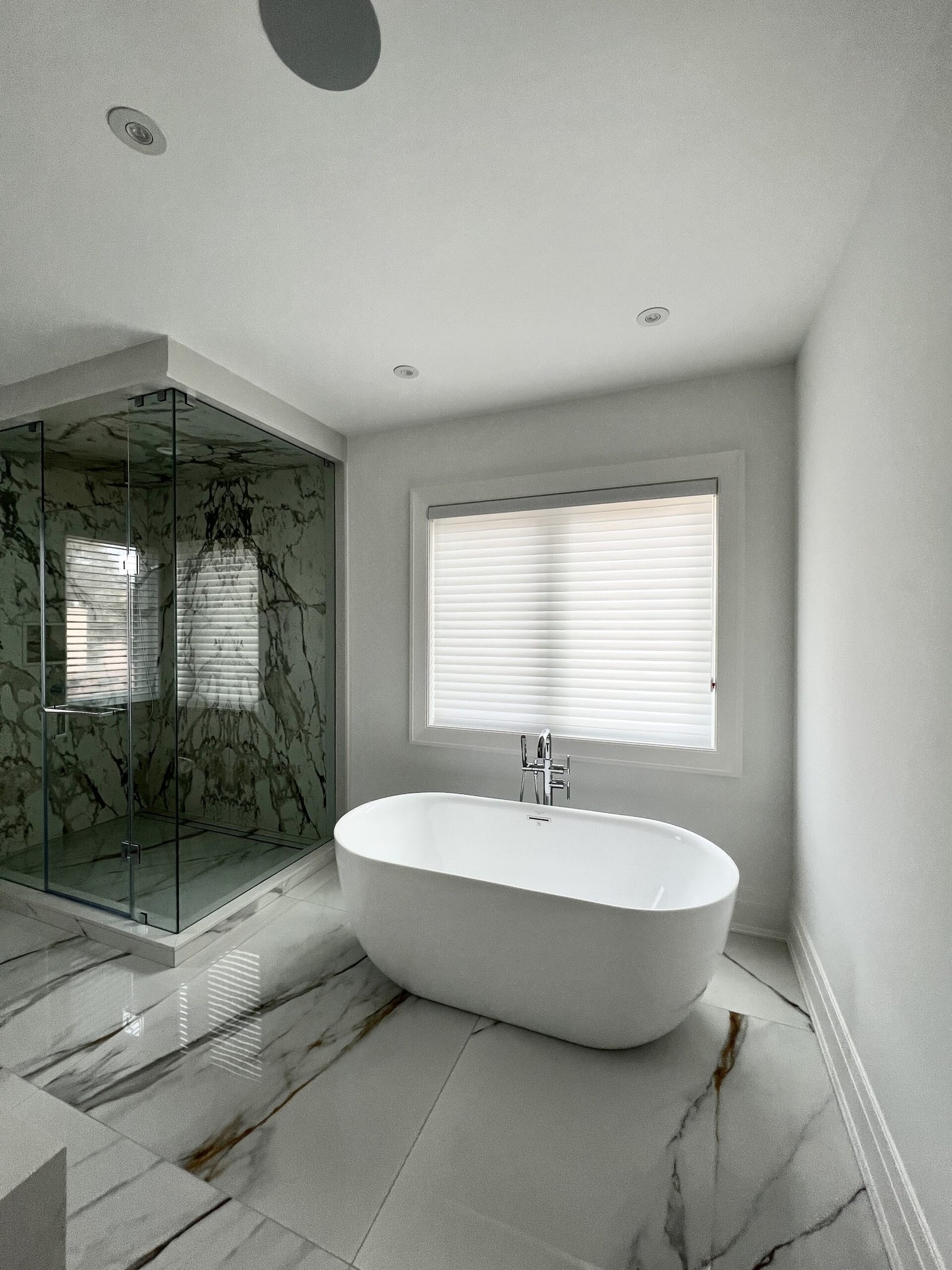 White triple sheer Vienna shades in a marble ensuite bathroom in Toronto