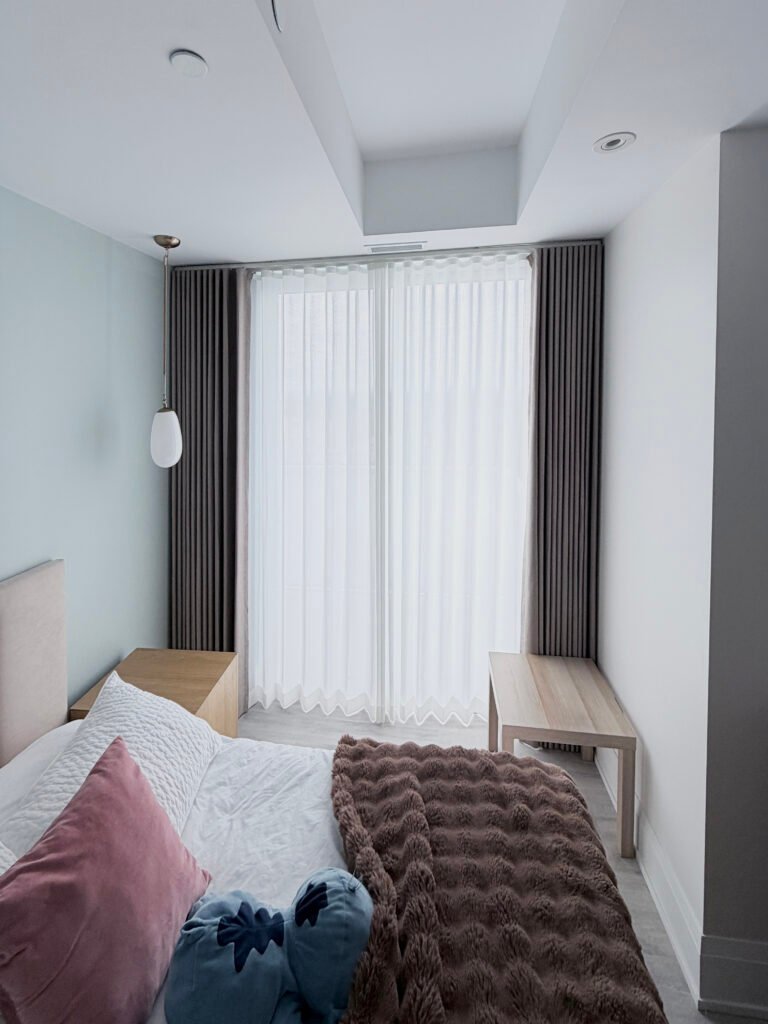 a double layer curtains in a toronto bedroom