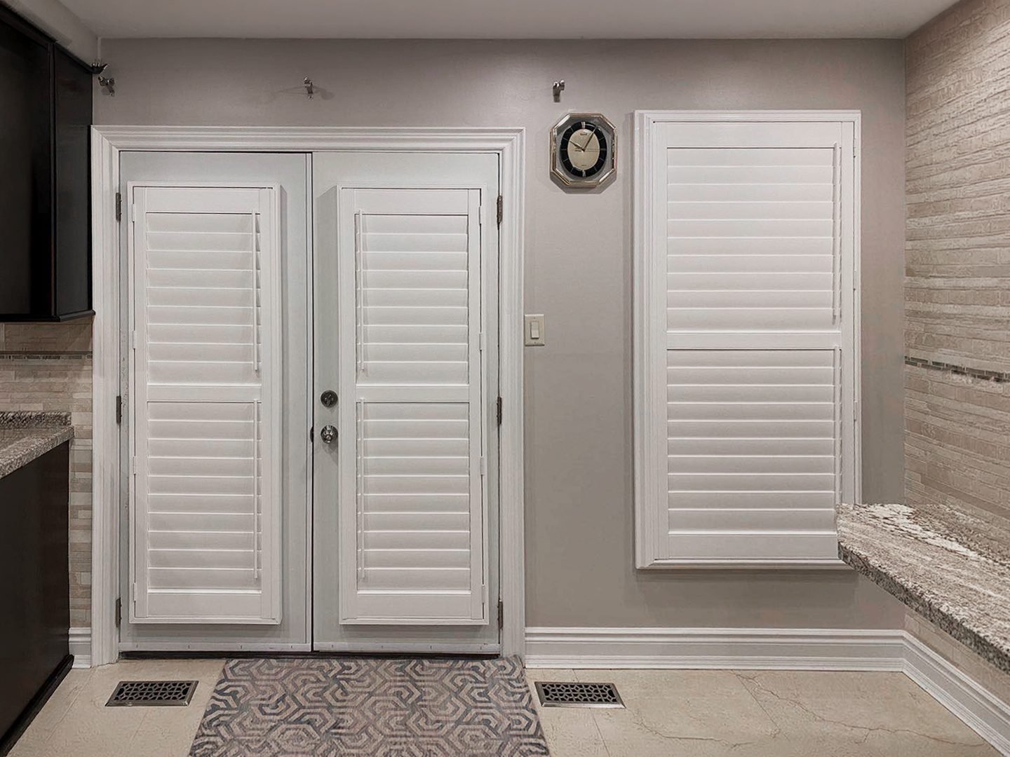 Plantation shutter panel mounted on a hinged door in a Toronto home