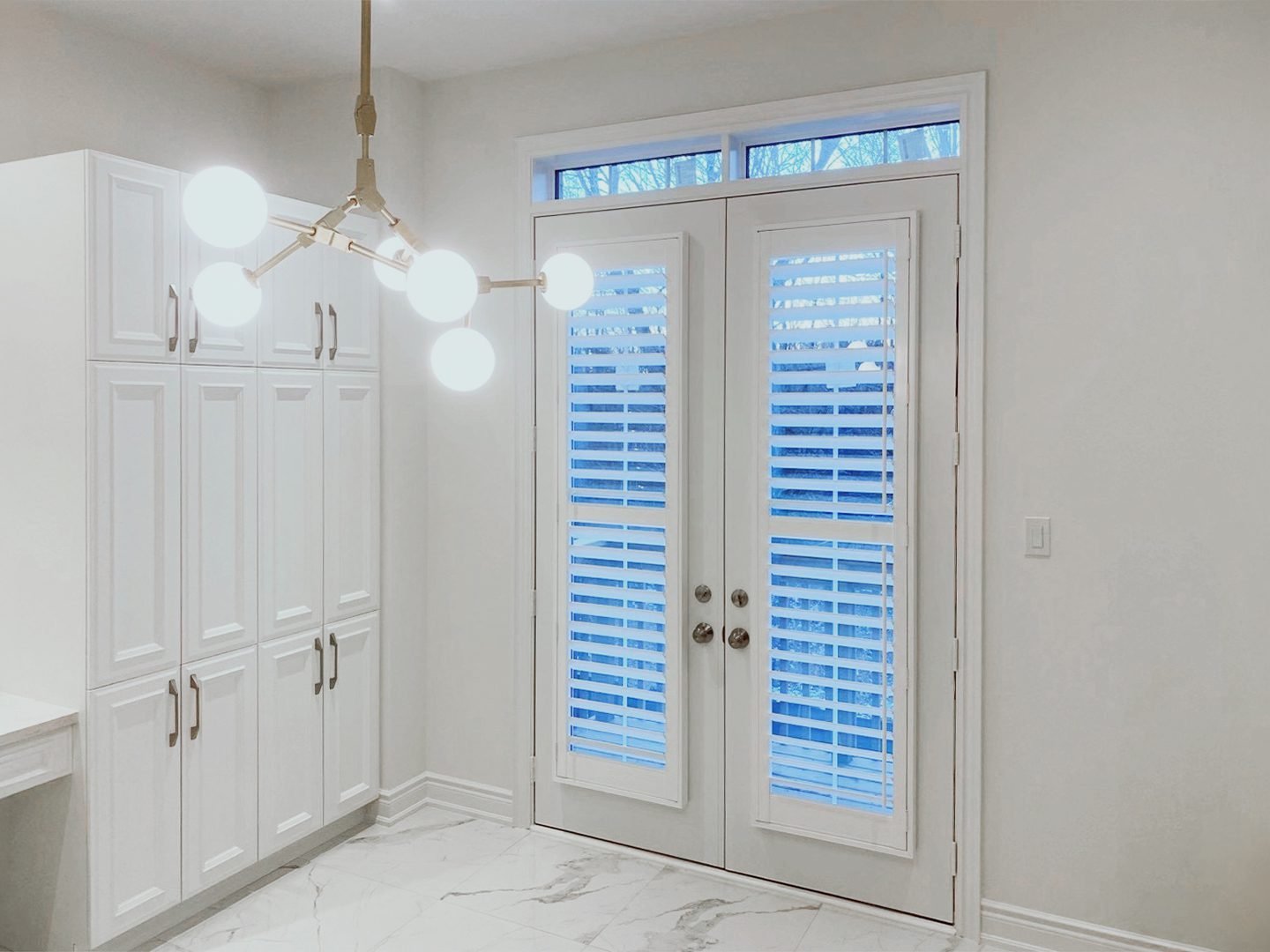 Plantation shutters mounted directly onto a French door in a Toronto home