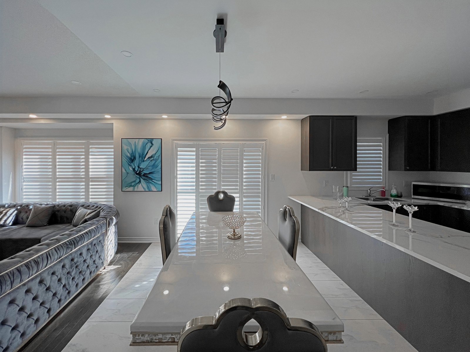 Bypass track shutter panels slid open to clear the doorway in a Toronto home