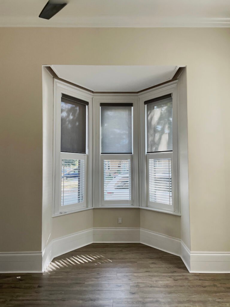 cafe style california shutters with solar shades in toronto home bay