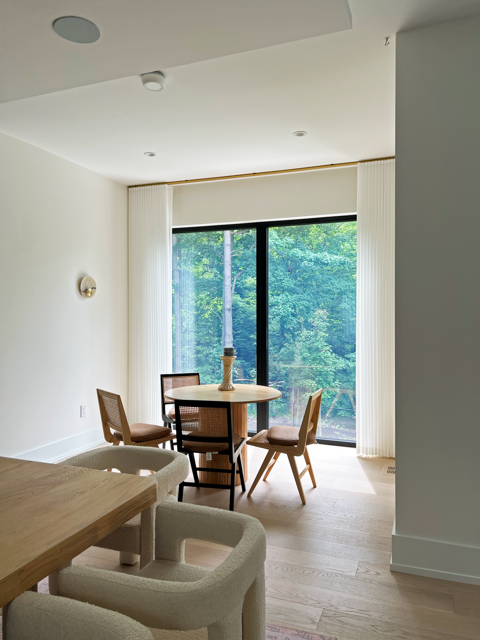 Sheer curtains filtering afternoon light in a Mississauga dining area, custom made by Starlight Shutter