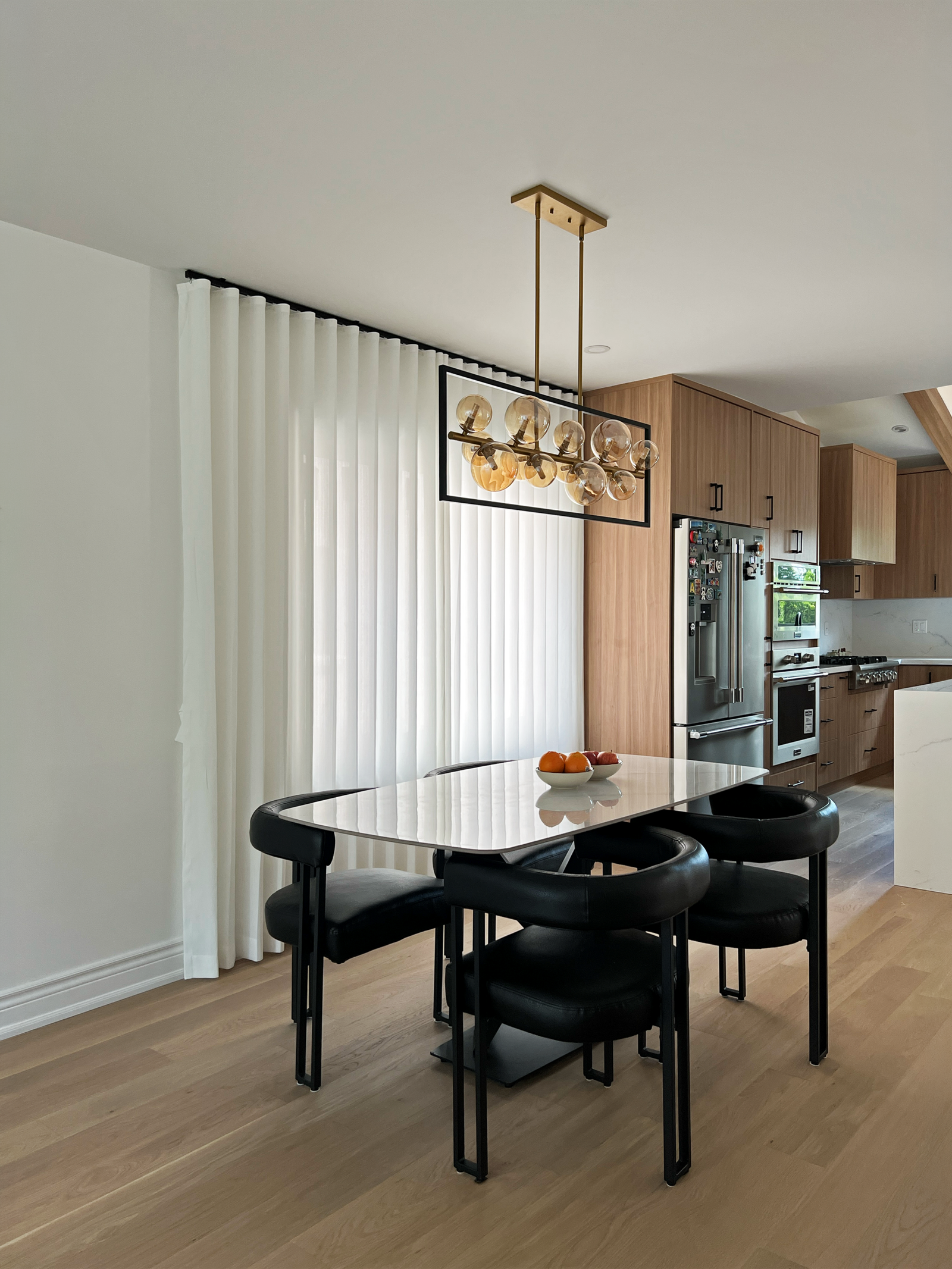 Custom blinds and layered drapery in a Stouffville living room by Starlight Shutter