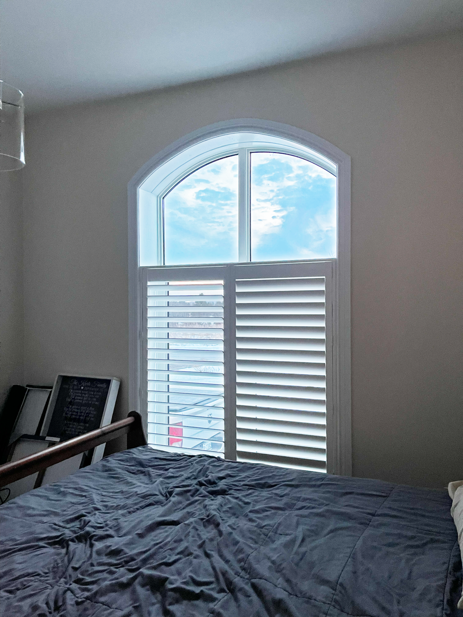 Custom California shutters in a primary bedroom in Whitby, Ontario
