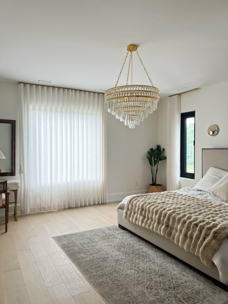 Linen drapery panels on a wide bedroom window in Mississauga.