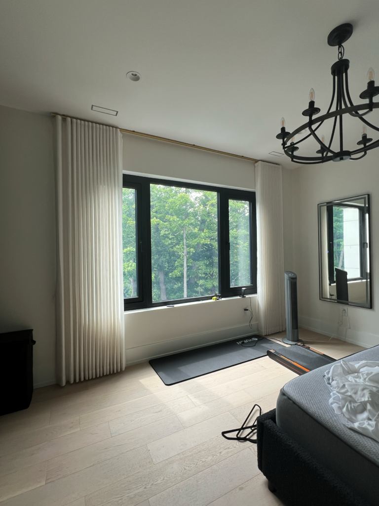 Full wall sheer drapery in a Mississauga guest bedroom.
