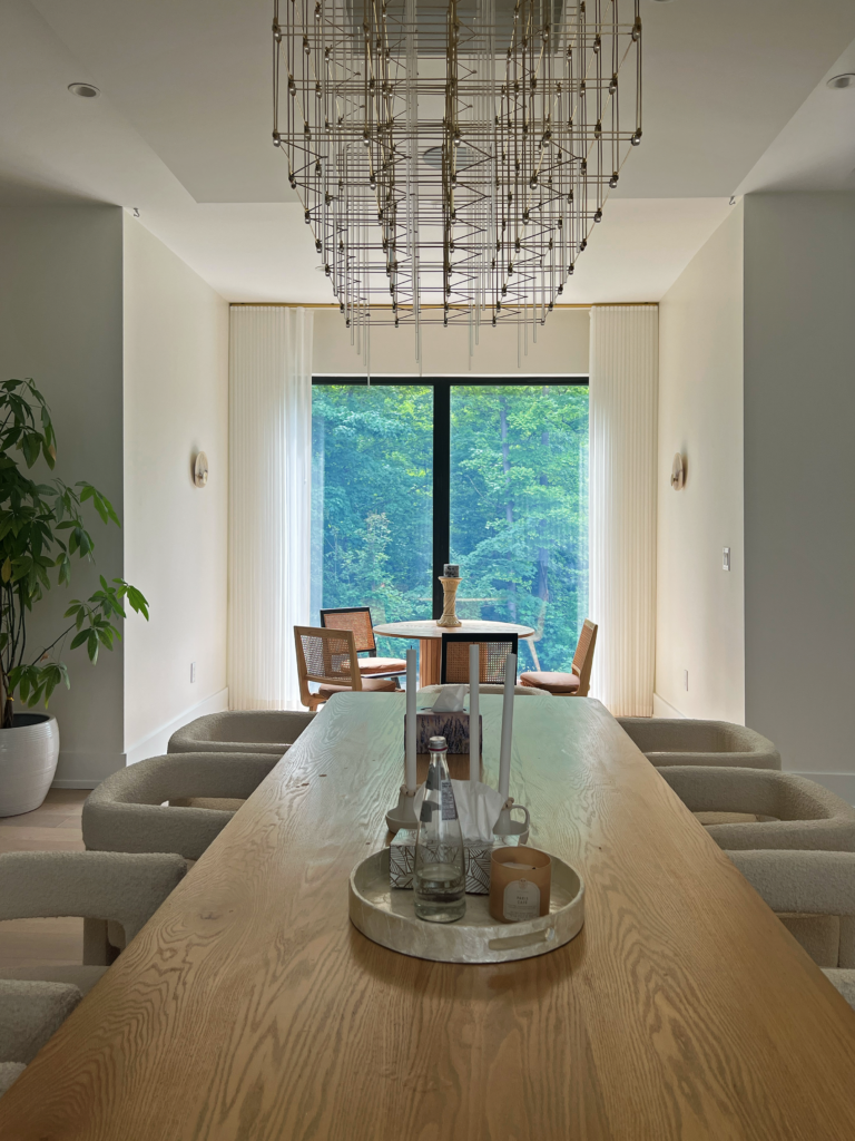 Sheer ripplefold drapery framing a dining room window wall in Mississauga.
